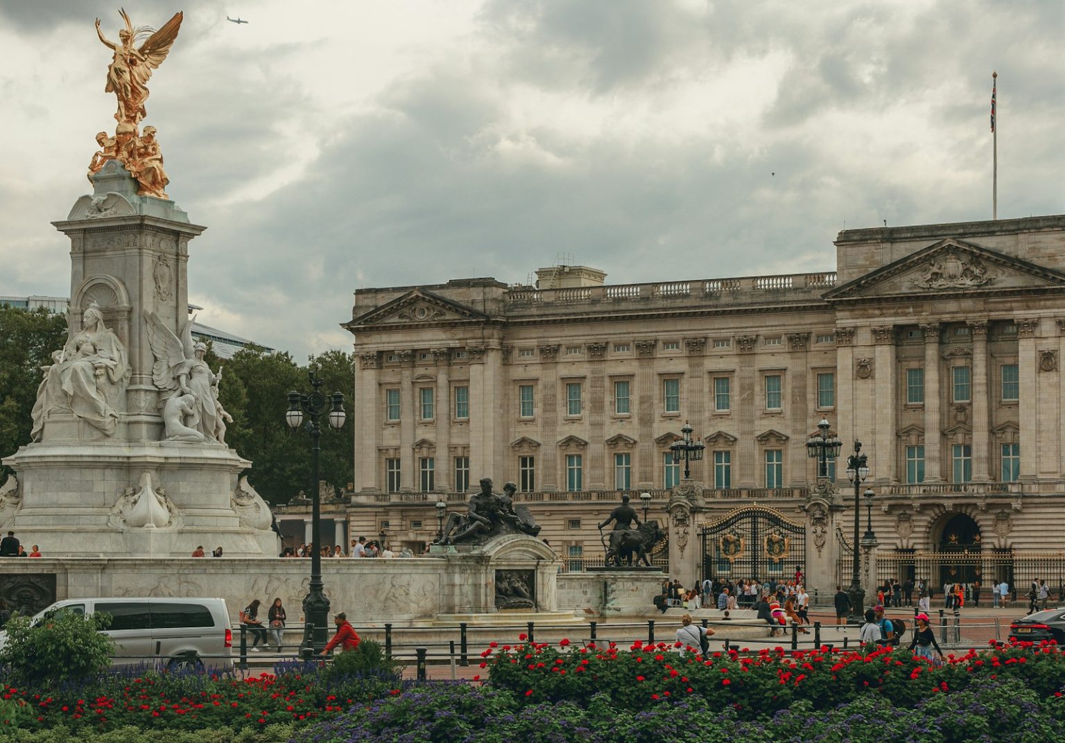 a large building with a statue in front of it